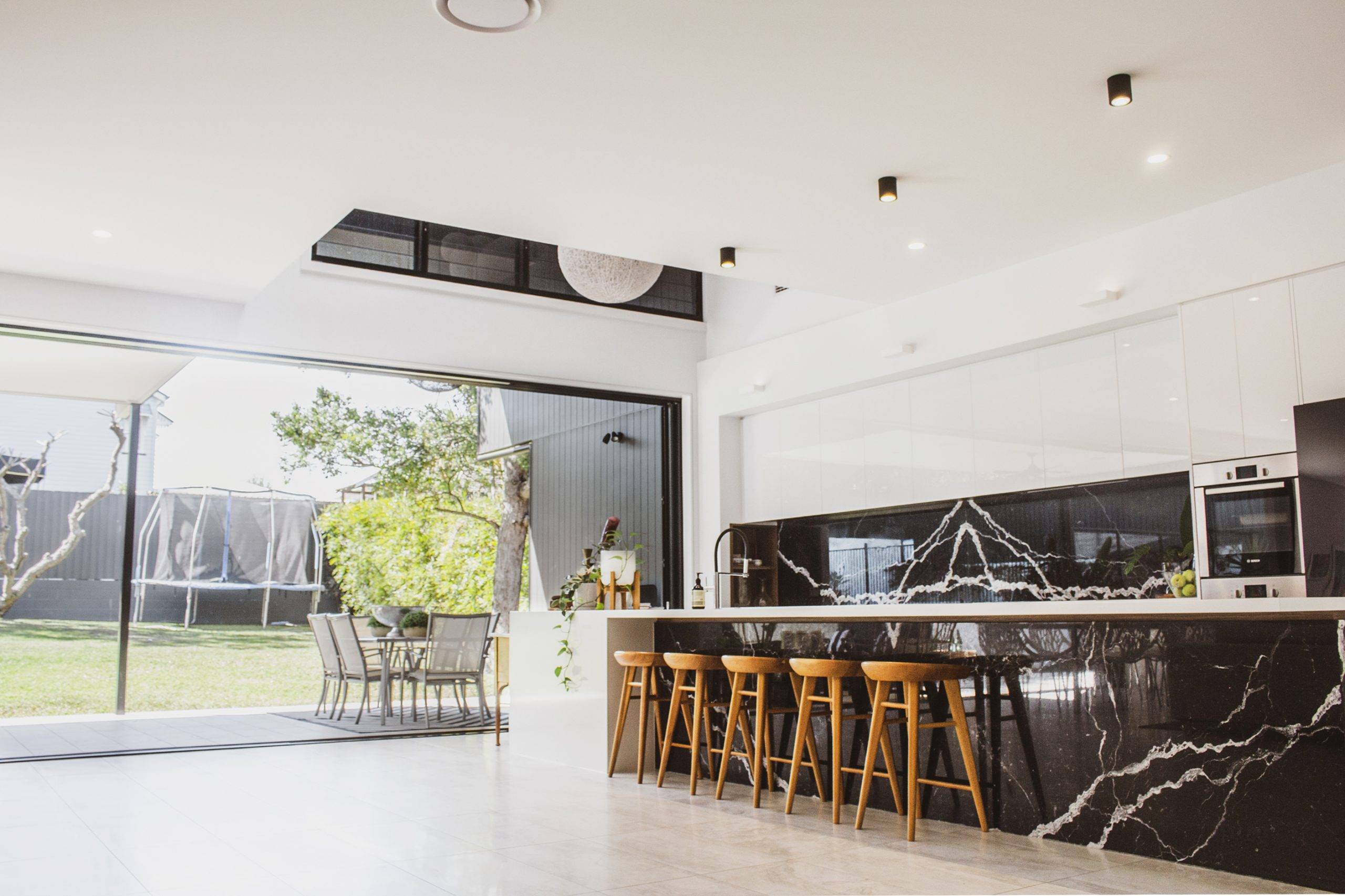 Architect designed minimalist, modern home, Minimalist palette of white, black, stained timber, and terrazzo tiles, Traditional Character Area, traditional Queenslander style